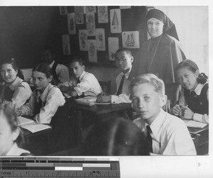 A Maryknoll Sister with her class at Dalian, China, 1939