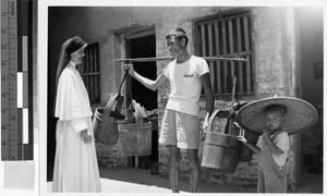 Maryknoll Sister Maria Riehl with a man and boy, Wuchow, China, ca. 1949