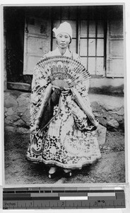 Korean woman holding painted fan, Korea, ca. 1920-1940