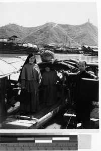 Maryknoll Sisters Maria Petra and Ann Carol standing on a boat, Wuchow, China, 1949