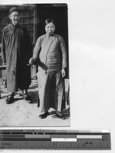 A young girl smoking a pipe at Chaoyangzhen, China, 1939