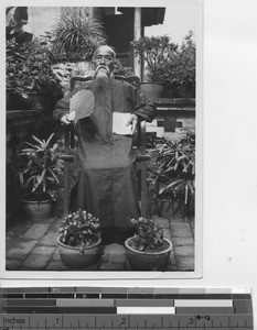 An elderly man studying to be a Catholic at Wuzhou, China