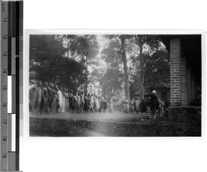 Brother Gemuseus allocates the porters, East Africa