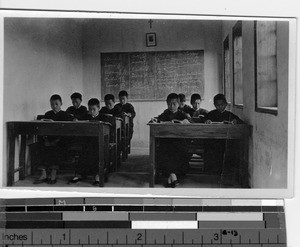 Students seated at desks in a classroom at Jiangmen, China, 1927