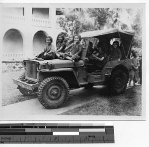 Orphan girls in jeep at Luoding, China, 1946