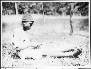 Boy making a rope, Pare, Tanzania, ca. 1927-1938