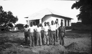 African apprentices standing in front of a school, Mali, Mozambique