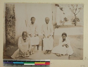Leprous patients outside a building, Ambohipiantrana, Antsirabe, Madagascar, 1901