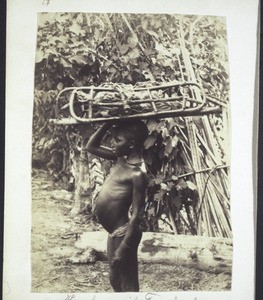 Boy with a carrying frame