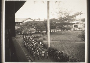 Schoolchildren singing to welcome Rev. Schimming