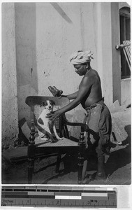 Joseph the watchman with his dog, Coimbatore, India, ca. 1910