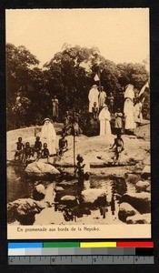 Missionary sisters standing on rocks by a stream, Congo, ca.1920-1940