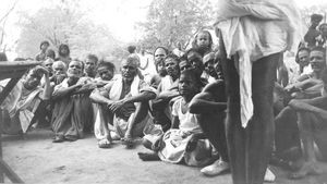 Tirukoilur District, South India. Lepers at Vaipur. The group seen from inside the Hut. (Used i