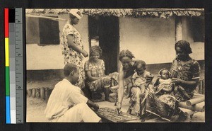 People playing a board game outside, Congo, ca.1920-1940