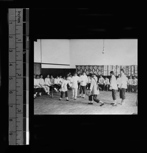 Girls playing a game in the gymnasium at Gamewell School, Beijing, China, 1920