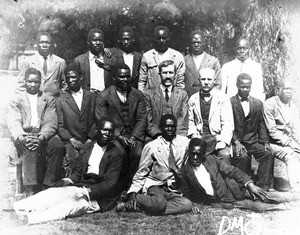 Swiss missionaries and African men