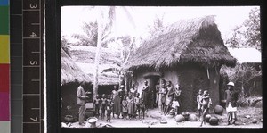 Catechist talking in Christian compound, Benin, ca. 1925-26