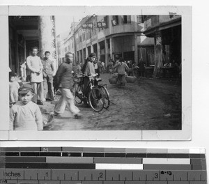 A Maryknoll Sister in a street scene at Mexien, China, 1949