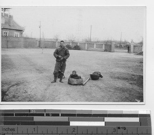 A peddler at the priests' compound at Fushun, China, 1930