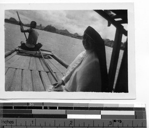 A Maryknoll Sister traveling by boat at Guilin, China, 1948