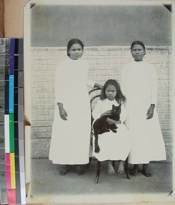 Three girls and a cat, Alakamisy, Madagascar, ca.1910