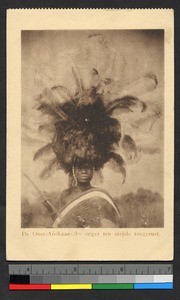 Man wearing elaborate headdress, German East Africa, ca.1920-1940