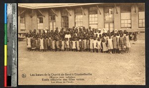 Students posed with clergy, Lubumbashi, Congo, ca.1920-1940