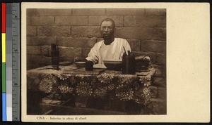 Scribe waits for clients at a table, China, ca.1920-1940