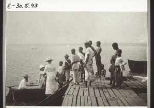 Climbing into a boat from the jetty of the Basel Mission Trading Company in Bonaku (Cameroon)