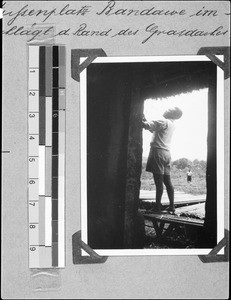 A man working on a house, Bandawe, Malawi, 1936