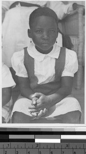 Close-up view of a girl sitting down, Africa, March 1950