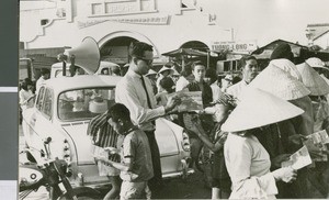 Don Wright Hands out Religious Tracts, Ho Chi Minh City, Vietnam, ca.1964-1968