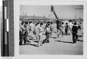 Children on the playground at Granada Japanese Relocation Camp, Amache, Colorado, ca. 1942