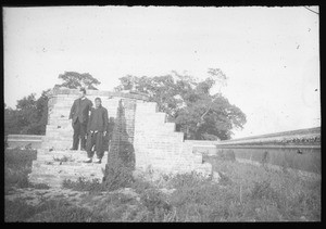 Two men standing on brick stairs, China, ca. 1918-1938