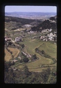 village with houses in the foreground and mountains in the background