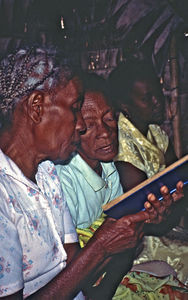 Madagascar, 1997. Three women at worship in a small church in Madagascar's tropical rainforest