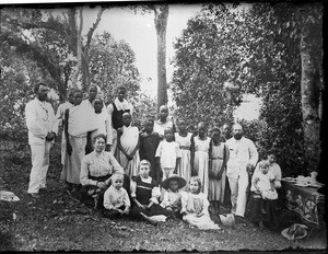 Missionary families and Africans posing in the garden, Tanzania, ca.1893-1920