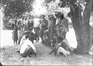 Men playing a game, Ricatla, Mozambique, ca. 1896-1911