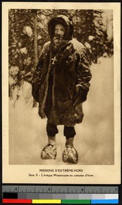 Bishop wearing thick furs in a snowy forest, Canada, ca.1920-1940