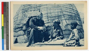 Missionary father showing crucifix to elderly woman, South Africa, ca.1920-1940