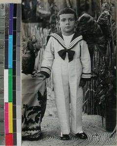 A young boy wearing a childs sailor suit, Morondava(?), Madagascar