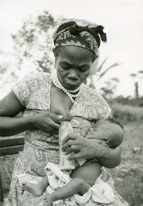 Fang woman giving her breast milk, in Ebeigne, Gabon