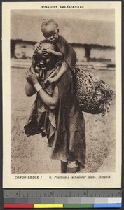 Baby hangs on tight while riding up high, Congo, ca.1920-1940