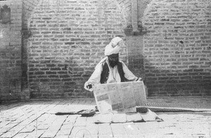 Pakistan, North West frontier Province (NWFP). A Pathan man immersed in reading (of what?)