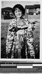 Smiling Japanese girl wearing a kimono, Japan, ca. 1939