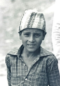 Nepal, April 1984. Boy with the traditional cap (Topi)