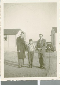 Keith Coleman and Loyd Collier Stand with an Orphaned by at the Boys' Home, Frankfurt, Germany, ca.1948-1958