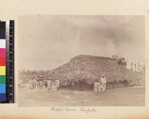 Missionary's family and indigenous preachers's family outside village home, Uripeta, India, ca.1885-1895