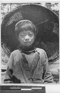 A boy with a large hat from Yunnan, China, 1946