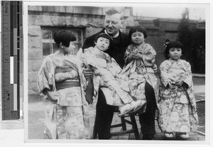 Fr. Hunt, MM, with four Japanese girls dressed in kimonos, Japan, ca. 1937